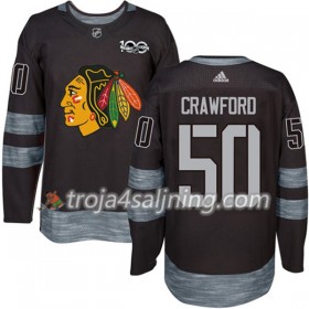 Chicago Blackhawks tröja Corey Crawford 50 1917-2017 100th Anniversary Adidas Svart Authentic - NHL Tröjor Herr